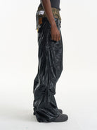 BLINDNOPLAN Faux Leather Layered Cargo Pants in Black - On Male Model