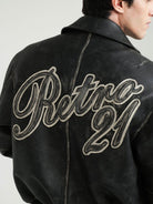 Retro 21 Distressed Faux Leather Padded Jacket in Black - On Male Model