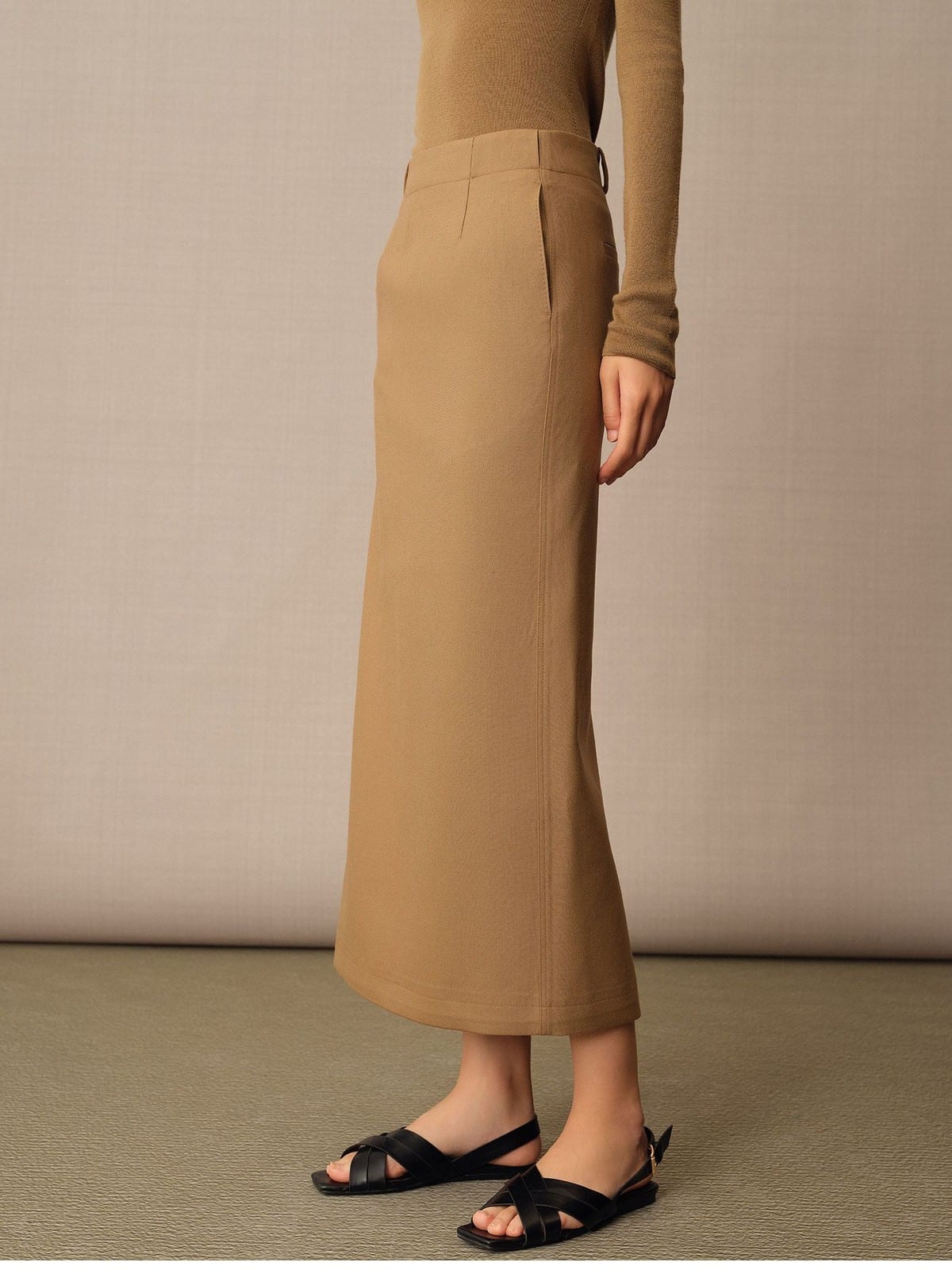 TEASEL Merino Wool Pleated Trousers in Brown - On Female Model