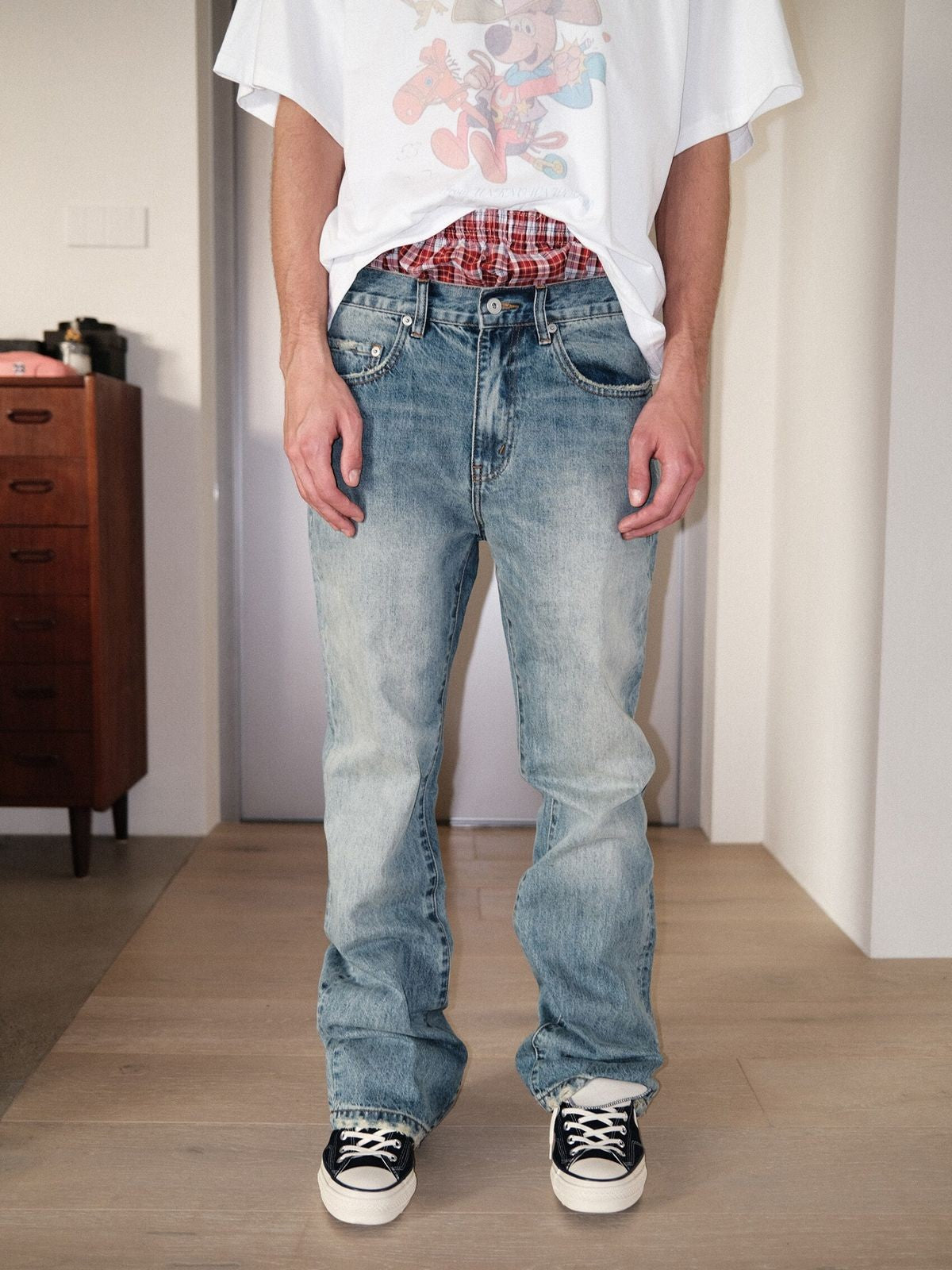 UNKNOWNWORLD Ice Blue Washed Micro Flare Jeans in Blue - On Male Model