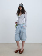 RARELY ALIKE Cropped Cotton Lantern Cargo Shorts in Sky Blue - On Female Model