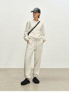 MSBEAST Fleece Lined Cotton Sweatshirt Pants Set in Beige - On Female Model