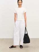 MSBEAST Cotton Blend Tapered Waist T Shirt in White - On Female Model