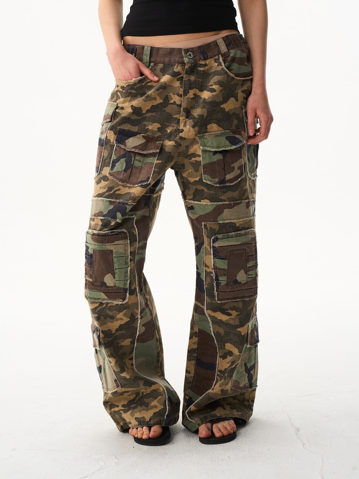 BLINDNOPLAN Paneled Camo Flared Cargo Pants in Green - On Female Model