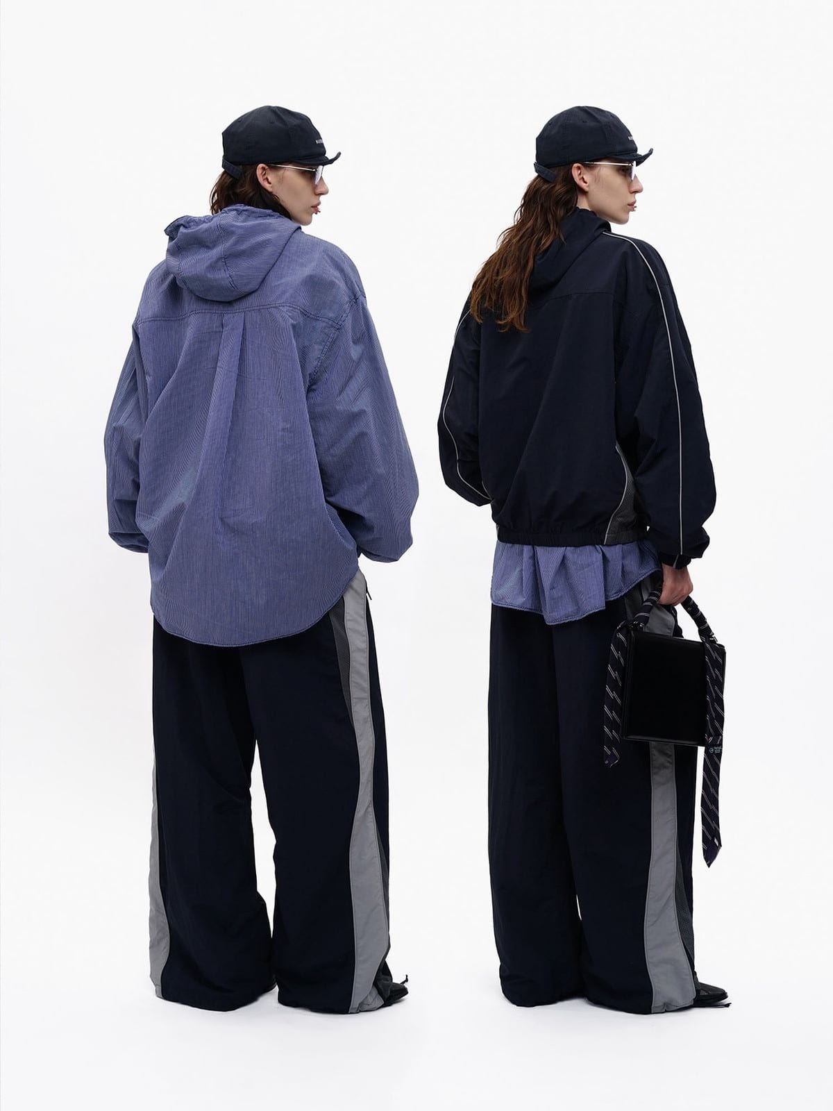 MASONPRINCE Two Way Coach Jacket Track Pants in Navy Blue - On Female Model