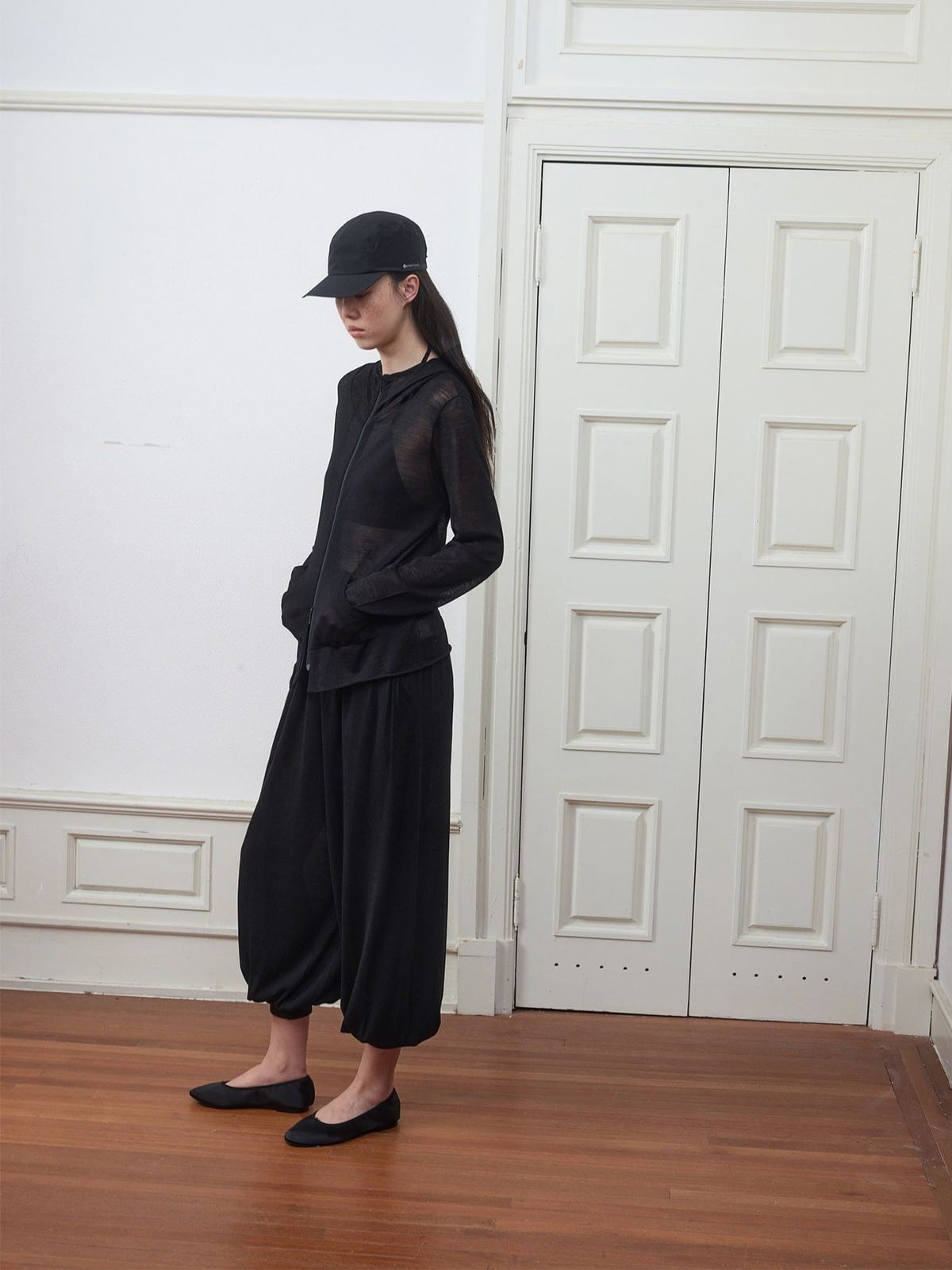 Random Piece Lightweight Merino Hooded Zip Cardigan in Black - On Female Model
