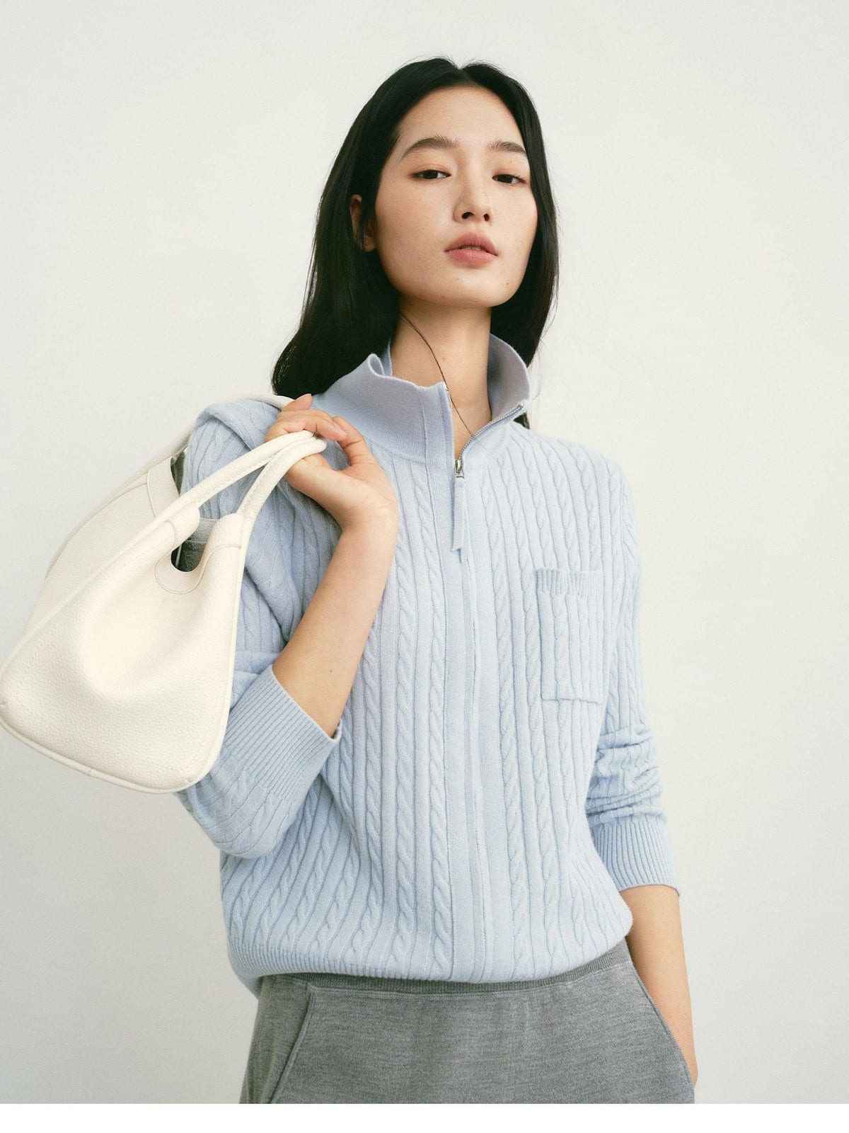 TEASEL Wool Cable Knit Zip Cardigan in Sky Blue - On Female Model