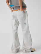 SIMPLE PROJECT Patchwork Distressed Flared Jeans in White - On Model