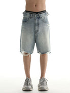MASONPRINCE Light Wash Raw Hem Denim Shorts in Blue - On Male Model