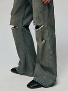 SIMPLE PROJECT Distressed Vintage Wash Flare Jeans in Blue - On Model