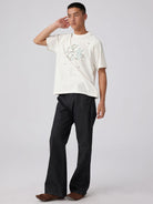 SIMPLE PROJECT Brass Stud Retro Logo Cotton T Shirt in White - On Male Model