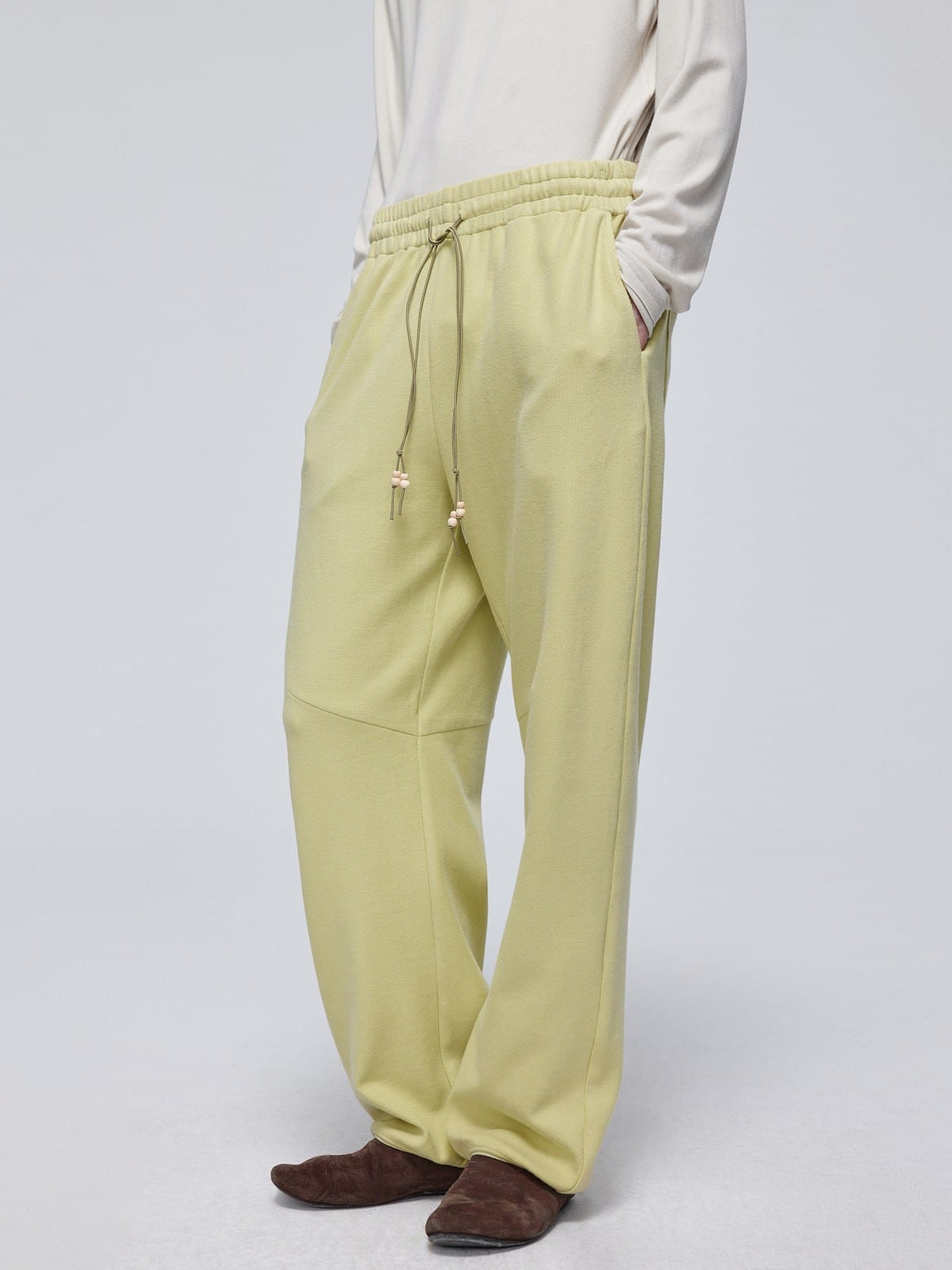 SIMPLE PROJECT Wooden Bead Drawstring Sweatpants in Mint - On Model