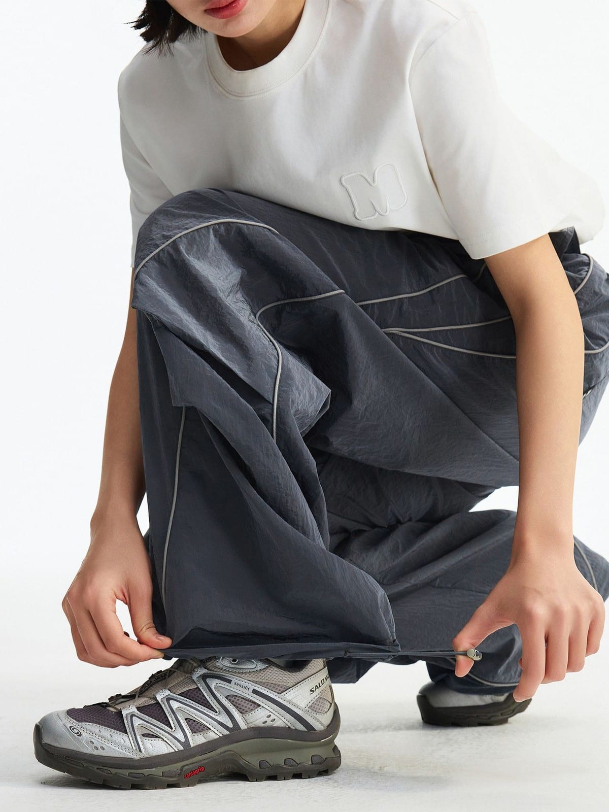 MEDM Glossy Piped Techwear Track Pants in Gray - On Female Model