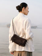 QIUZHEN Vegetable Tanned Leather Camera Bag in Brown - On Female Model