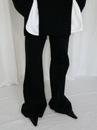 RARELY ALIKE Curved Seam Denim Flare Jeans in Black - On Model