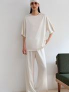 MSBEAST Oversized Acetate Satin T Shirt in White - On Female Model