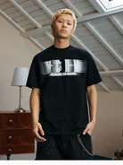 MEDM Glitch Logo Graphic Cotton T Shirt in Black - On Male Model