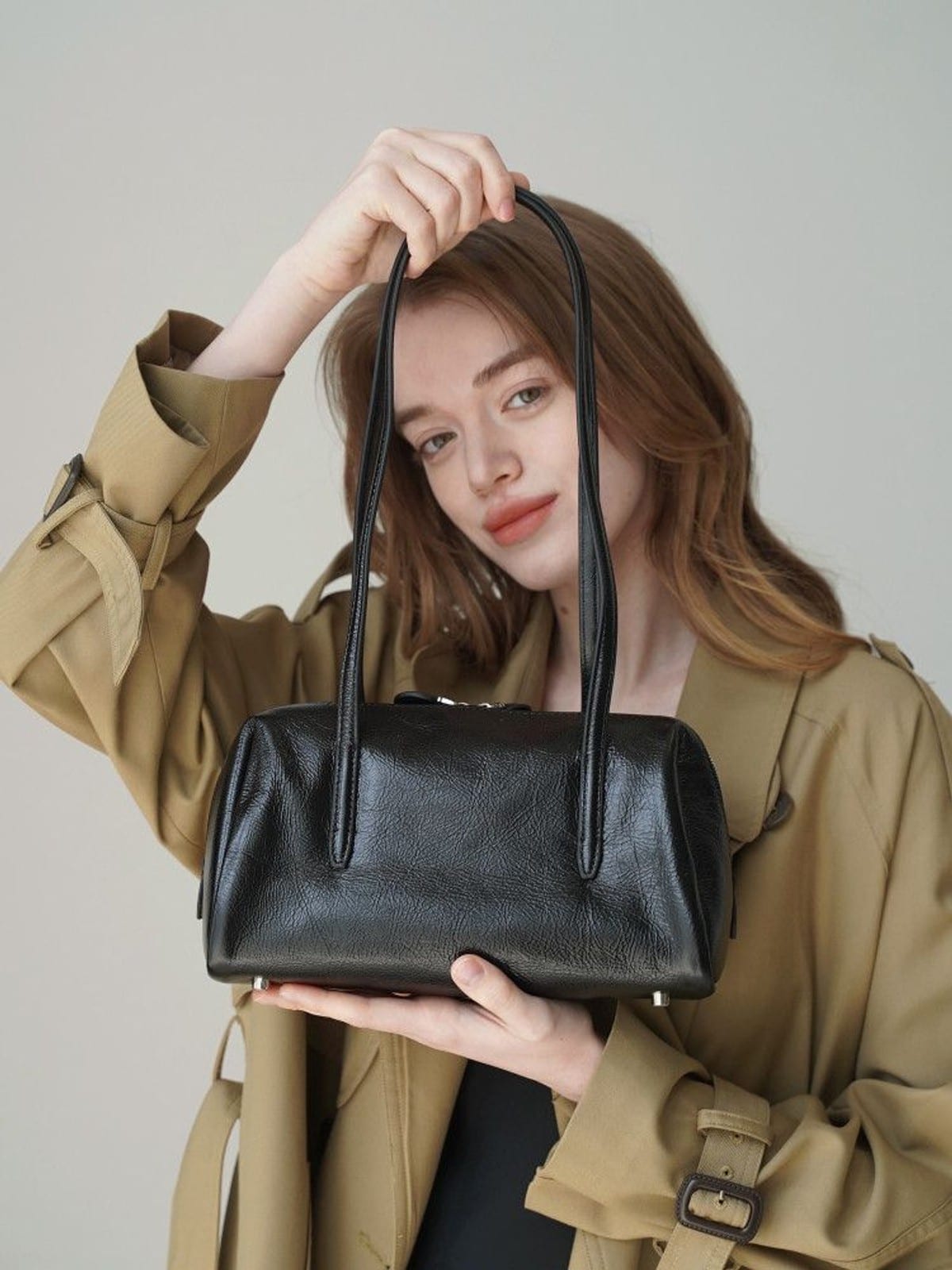 PANLULUPAN Oil Wax Leather Pillow Shoulder Bag in Beige - On Female Model