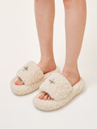 SMFK Cross Motif Faux Fur Platform Slides in White - On Model