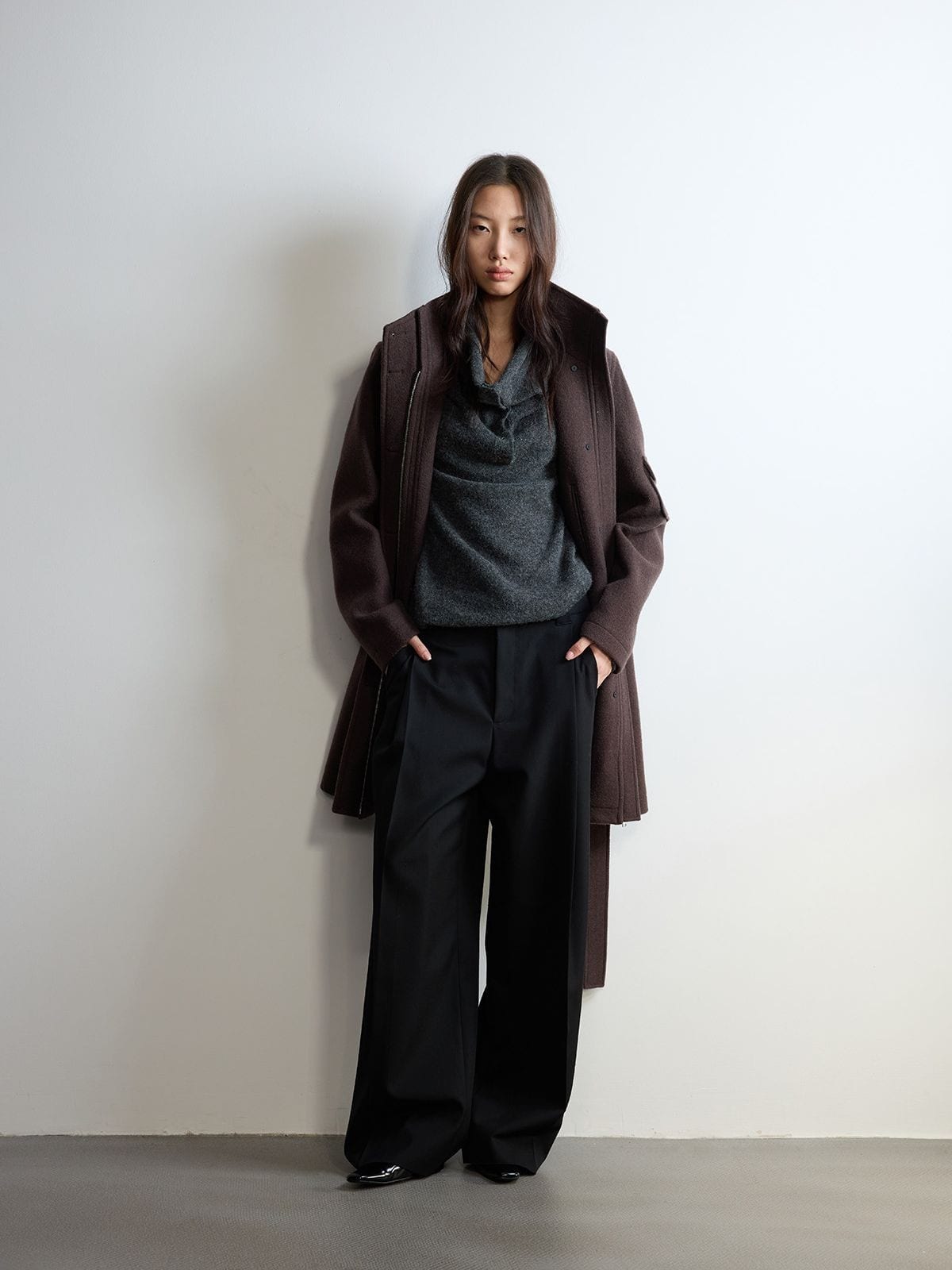 Random Piece Pleated Merino Wool Wide Leg Trousers in Black - On Female Model