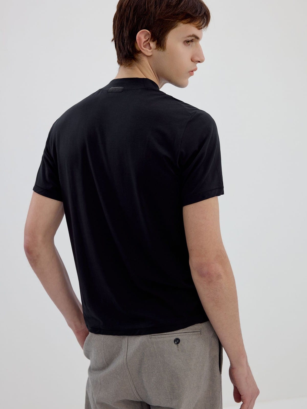 SIMPLE PROJECT Wool Blend Mock Neck T Shirt in Black - On Male Model