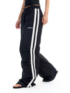 BLINDNOPLAN Striped Pleated Track Pants in Black - On Female Model