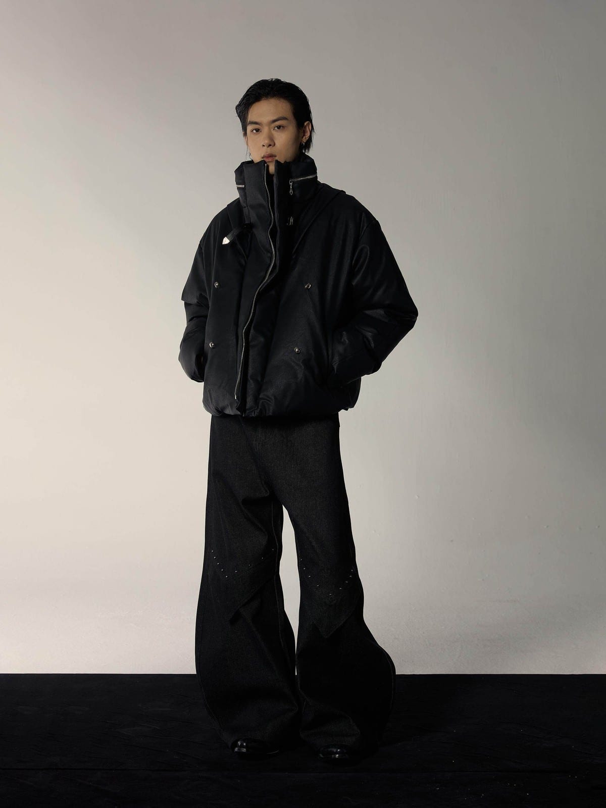 Y OFFICIAL Cropped Faux Leather Down Puffer in Black - On Male Model