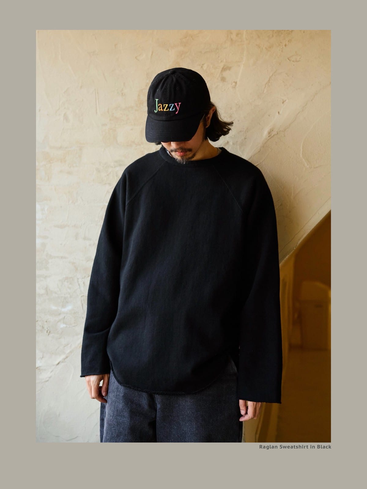 USAGE Slub Cotton Raglan Sweatshirt in Black - On Male Model