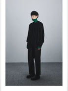 NANS Pleated Brushed Twill Cropped Pants in Black - On Male Model