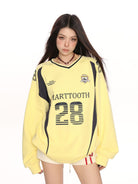 Big Gold studio V Neck Graphic Jersey Sweatshirt in Yellow - On Female Model