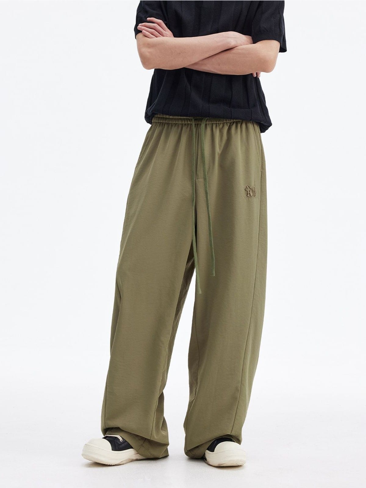 MEDM Lightweight Wide Leg Track Pants in Olive - On Male Model