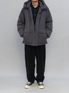 Soda Mid Length Hooded Down Puffer in Black - On Male Model