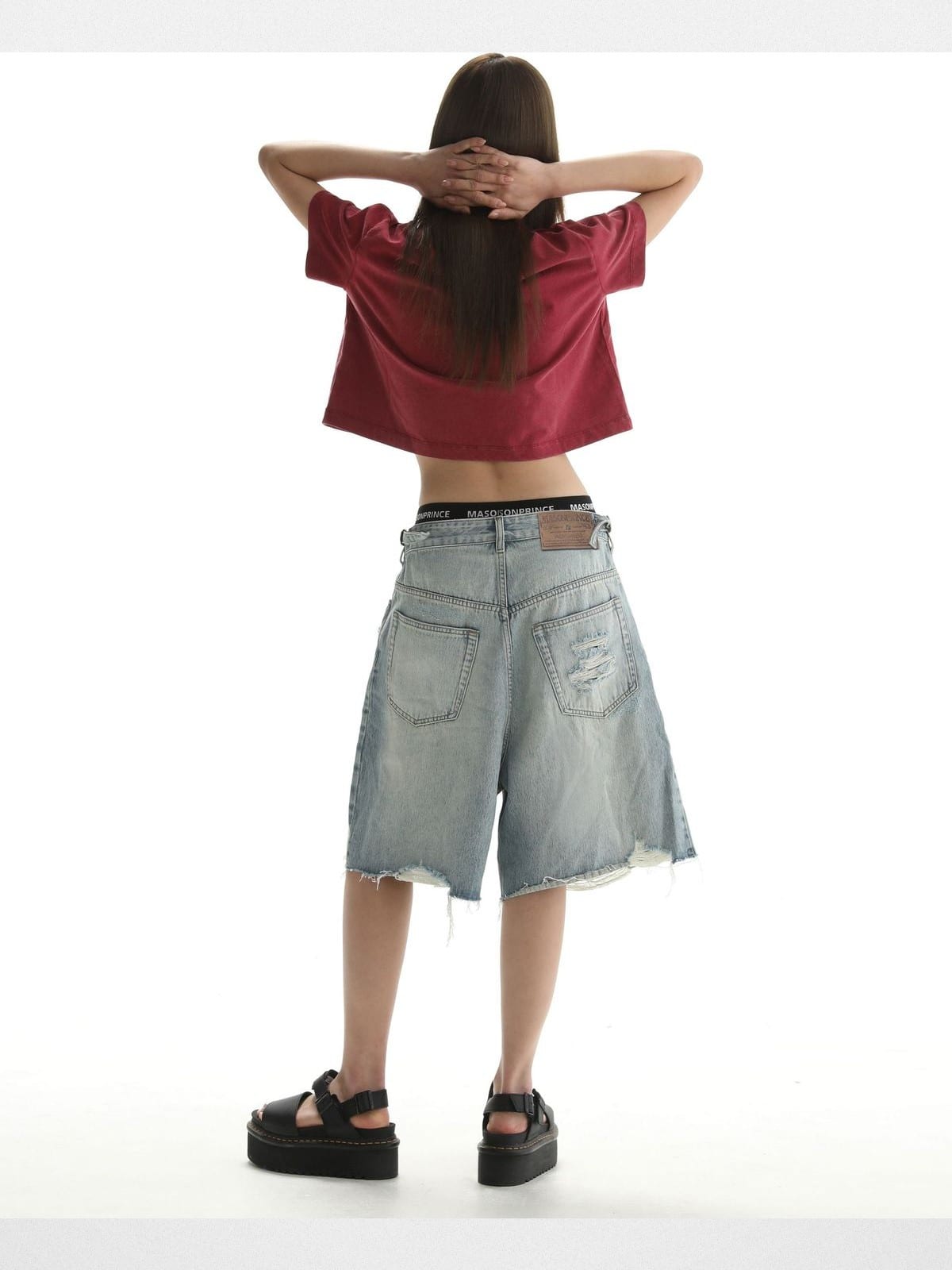 MASONPRINCE Light Wash Raw Hem Denim Shorts in Blue - On Female Model