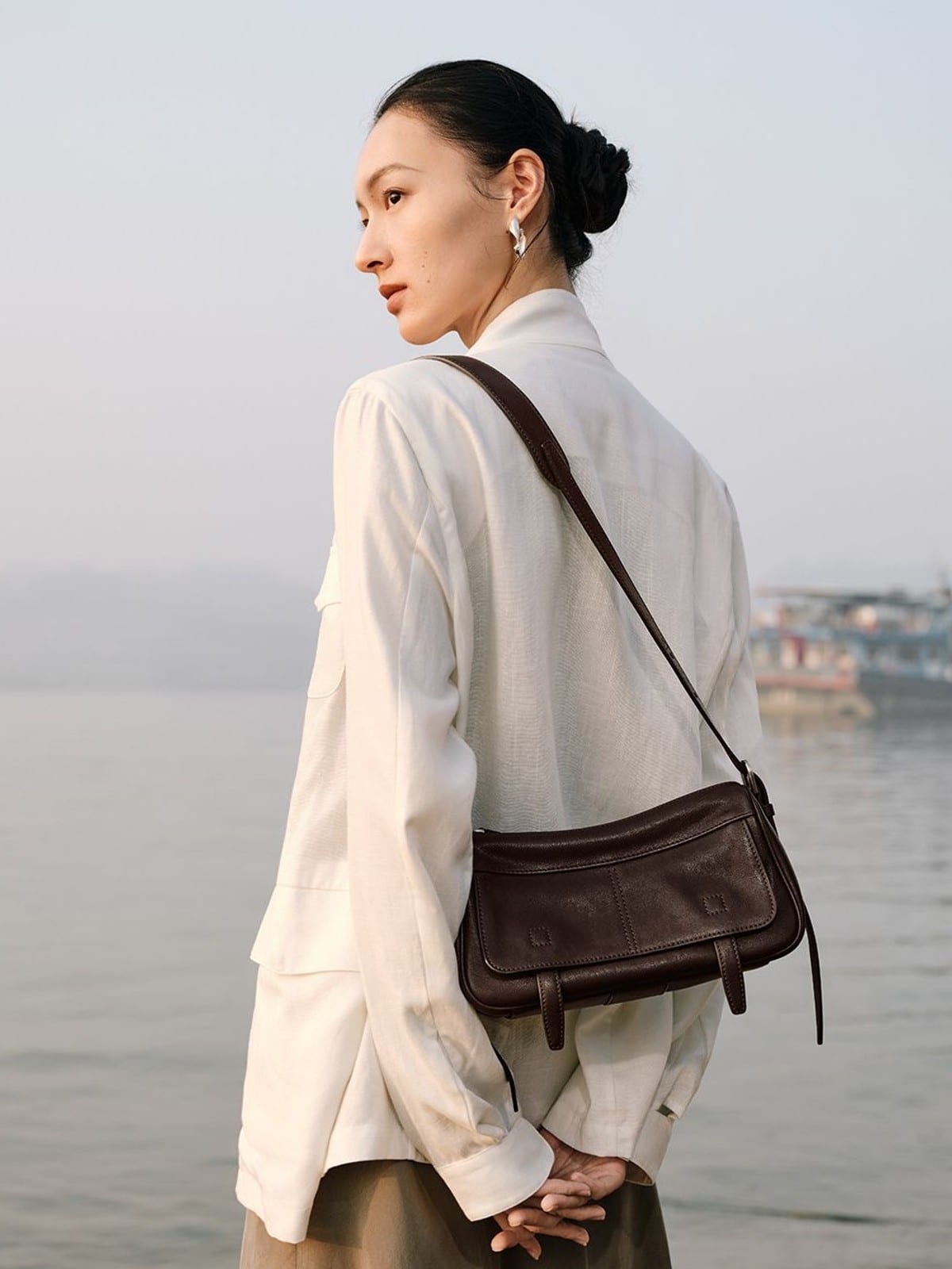 QIUZHEN Vegetable Tanned Leather Camera Bag in Brown - On Female Model