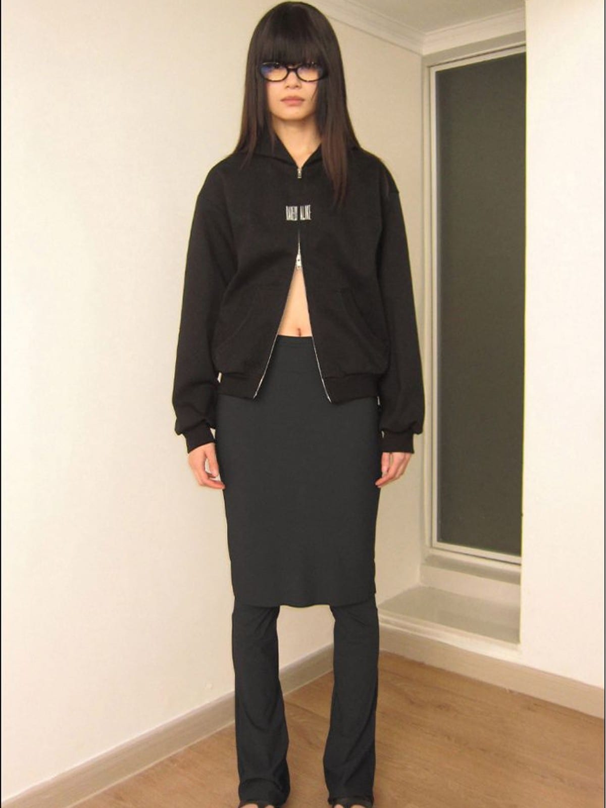RARELY ALIKE Cinched Waist Logo Zip Up Hoodie in Black - On Female Model