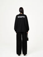 SMFK Cross Print Cotton Sweatshirt in Black - On Model