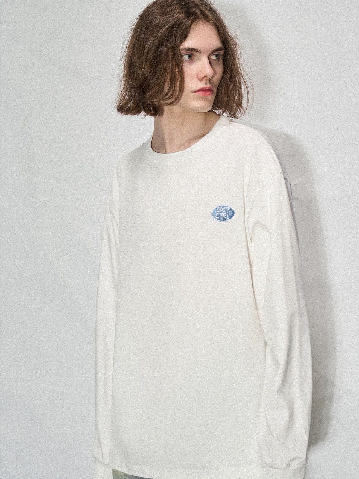 LOSTCTRL Embroidered Long Sleeve Cotton T Shirt in White - On Male Model
