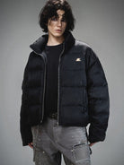 LOSTCTRL Minimalist Nylon Puffer Jacket in Black - On Male Model