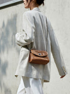 QIUZHEN Vintage Leather Envelope Crossbody in Brown - On Female Model