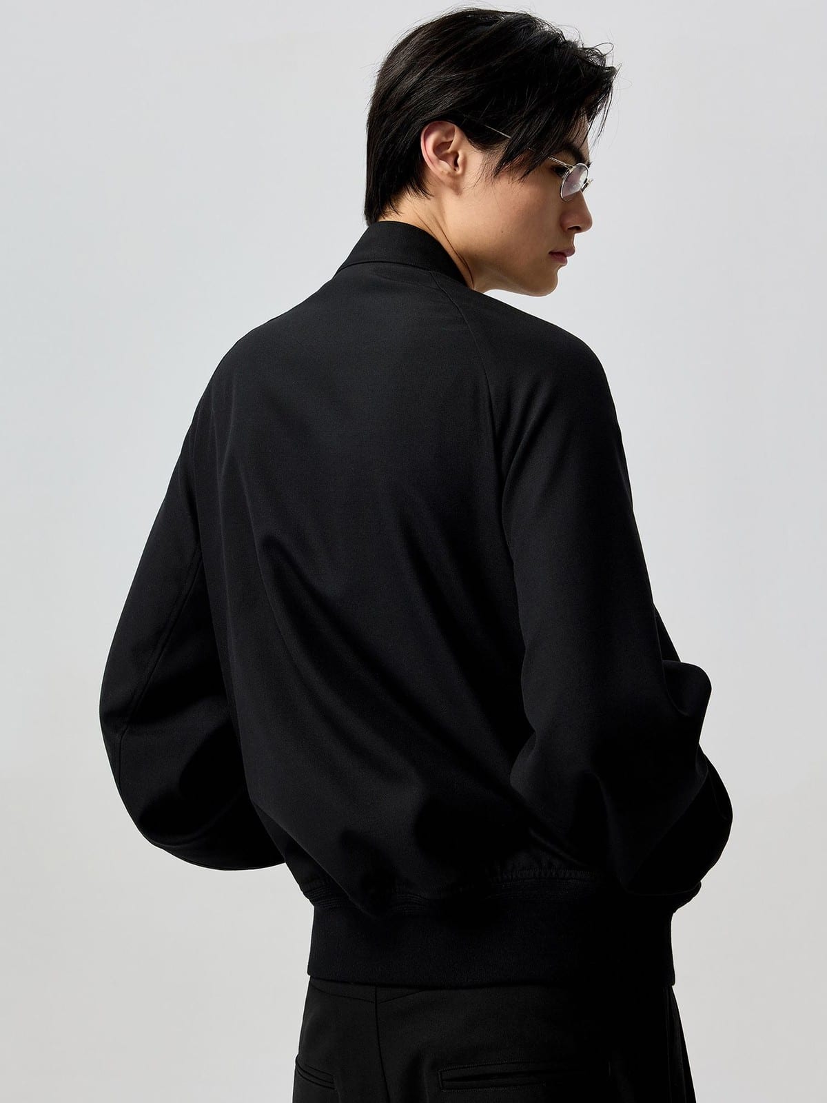 SIMPLE PROJECT Band Collar Worsted Wool Bomber Jacket in Black - On Male Model