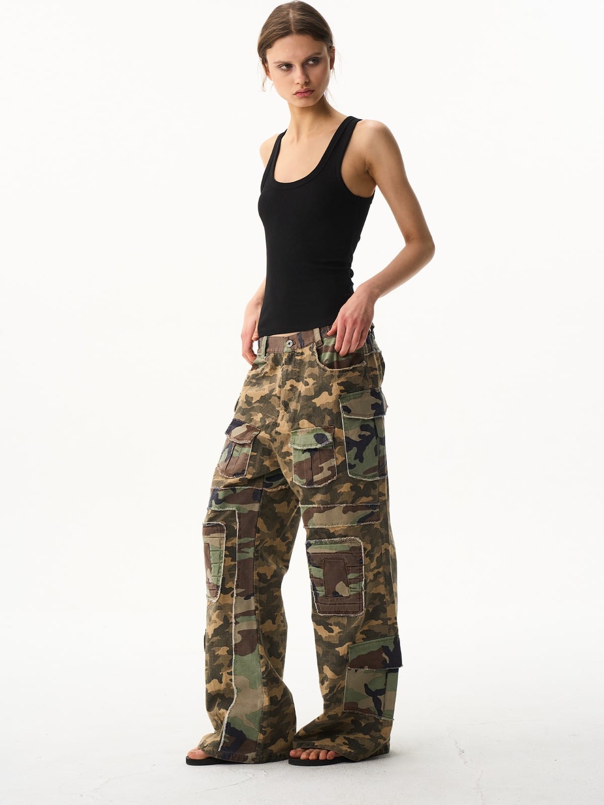 BLINDNOPLAN Paneled Camo Flared Cargo Pants in Green - On Female Model