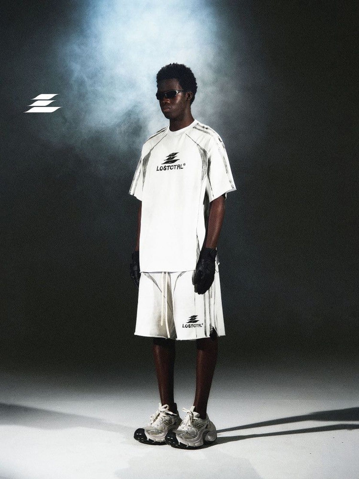 LOSTCTRL Distressed Structural Print Shorts in White - On Male Model