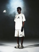 LOSTCTRL Distressed Structural Print Shorts in White - On Male Model