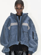 BLINDNOPLAN Distressed Hooded MA 1 Bomber Jacket in Blue - On Model