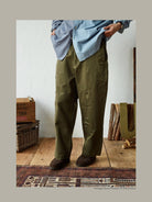 USAGE Hand Distressed Patched Chinos in Olive - On Male Model