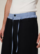 Retro 21 100 Italian Wool Double Waistband Trousers in Black - On Male Model