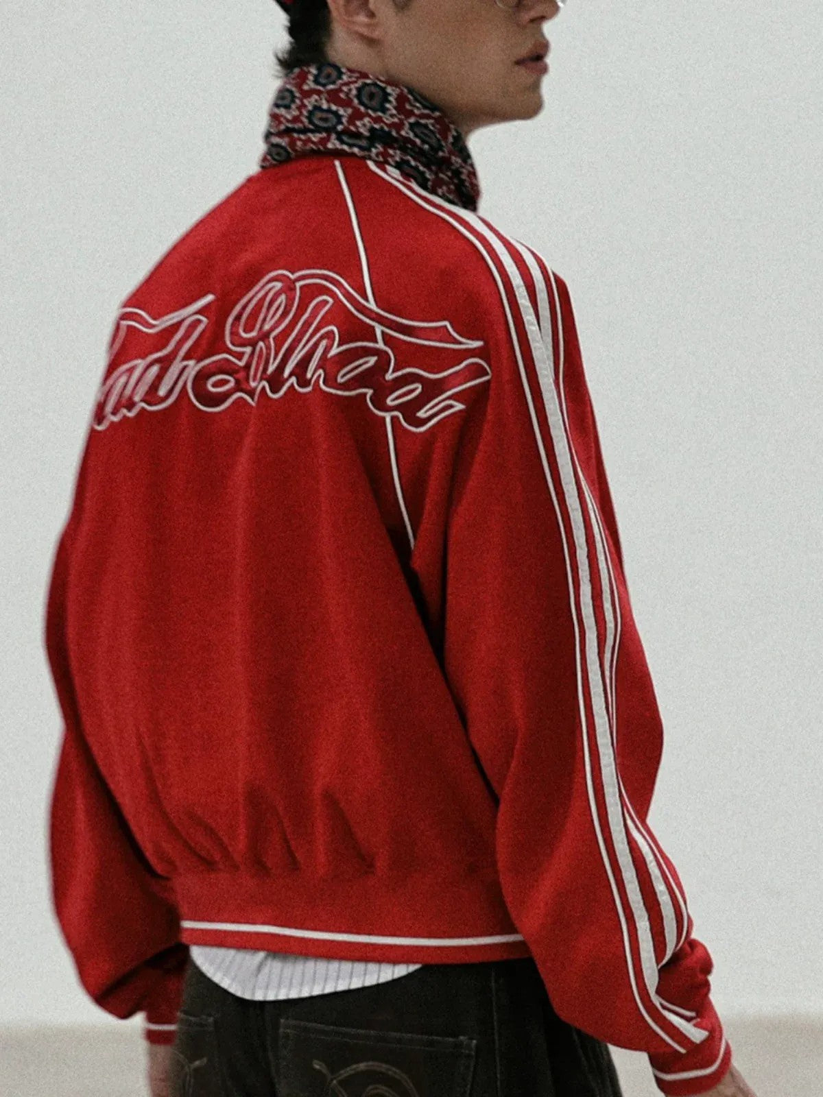 BADSEED Side Stripe Cotton Bomber Jacket in Red - On Male Model