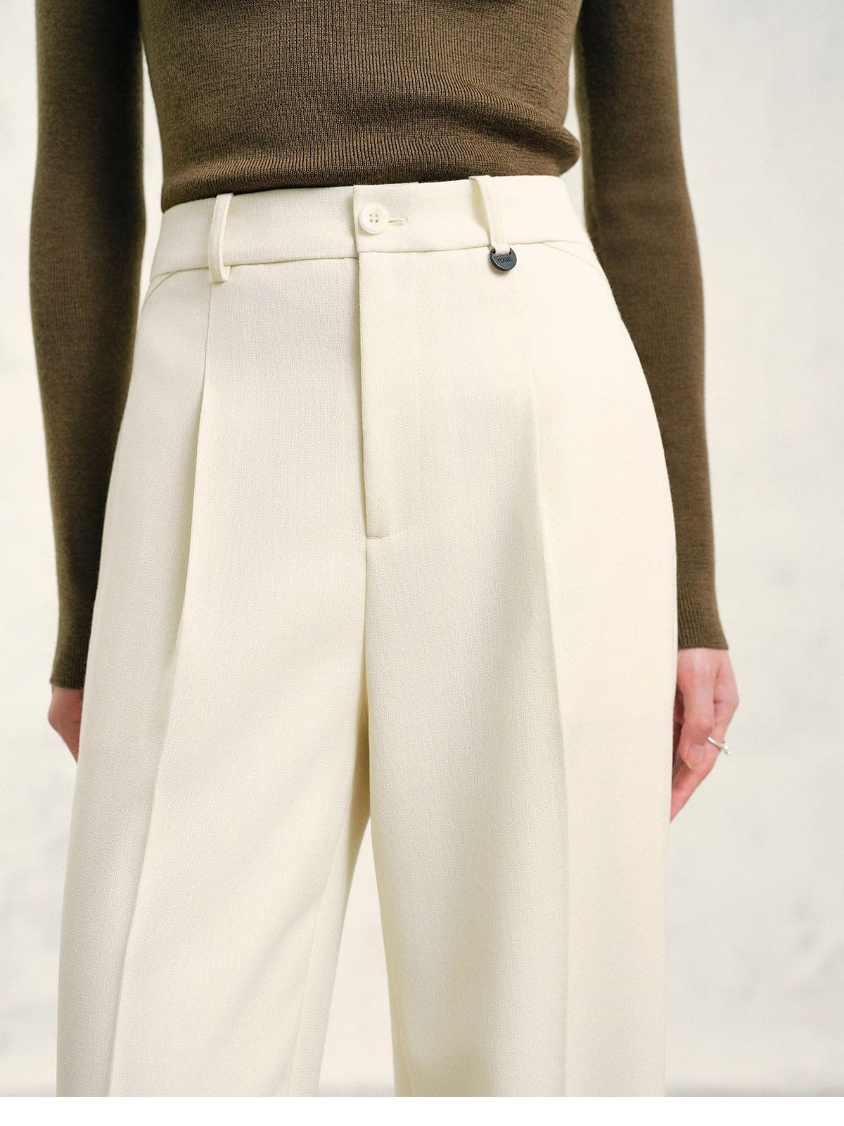 TEASEL Textured Wool Pleated Trousers in Cream - On Model