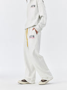 MEDM Fleece Lined Embroidered Sweatpants in White - On Female Model