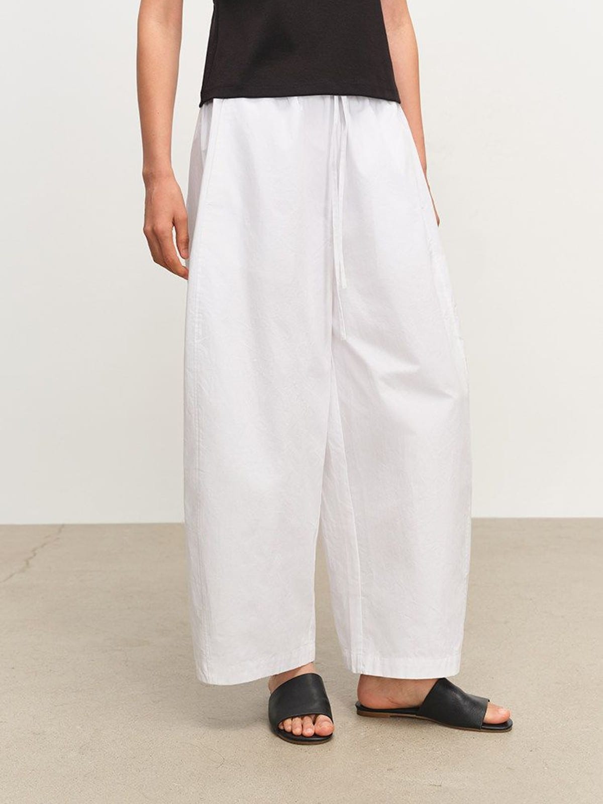 MSBEAST Paper Texture Cotton Balloon Pants in White - On Female Model